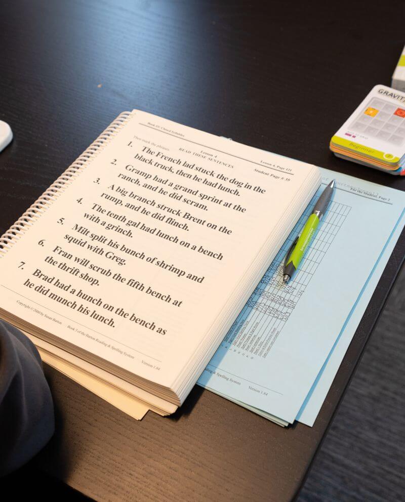 picture of reading book and therapist notes